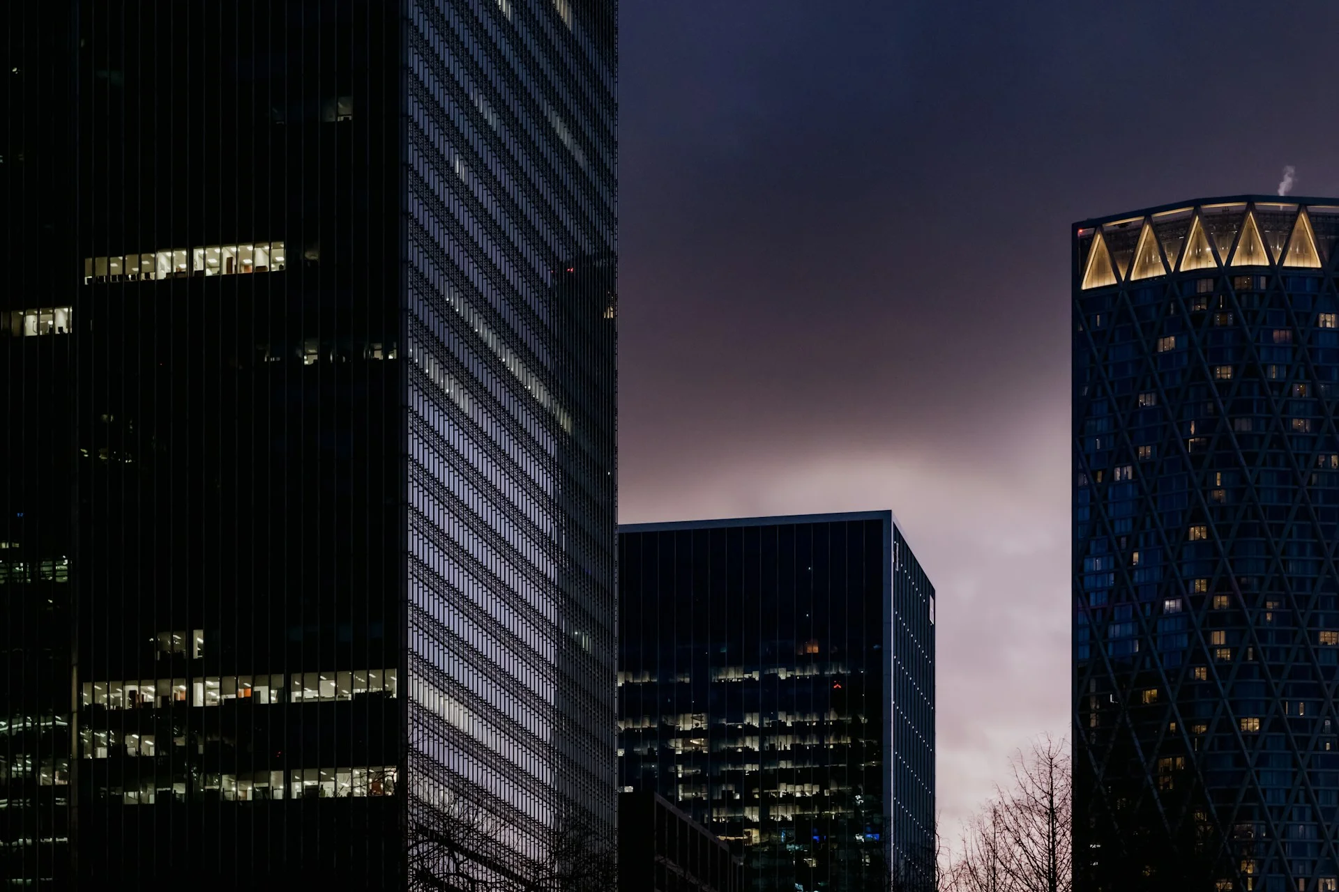 a-couple-of-tall-buildings-sitting-next-to-each-other-