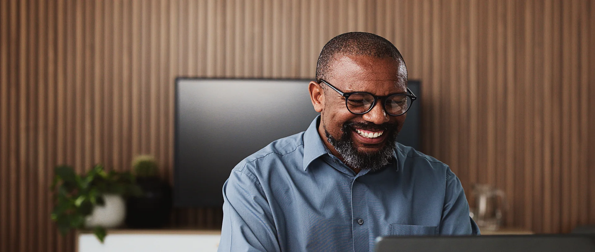 man in office smiling