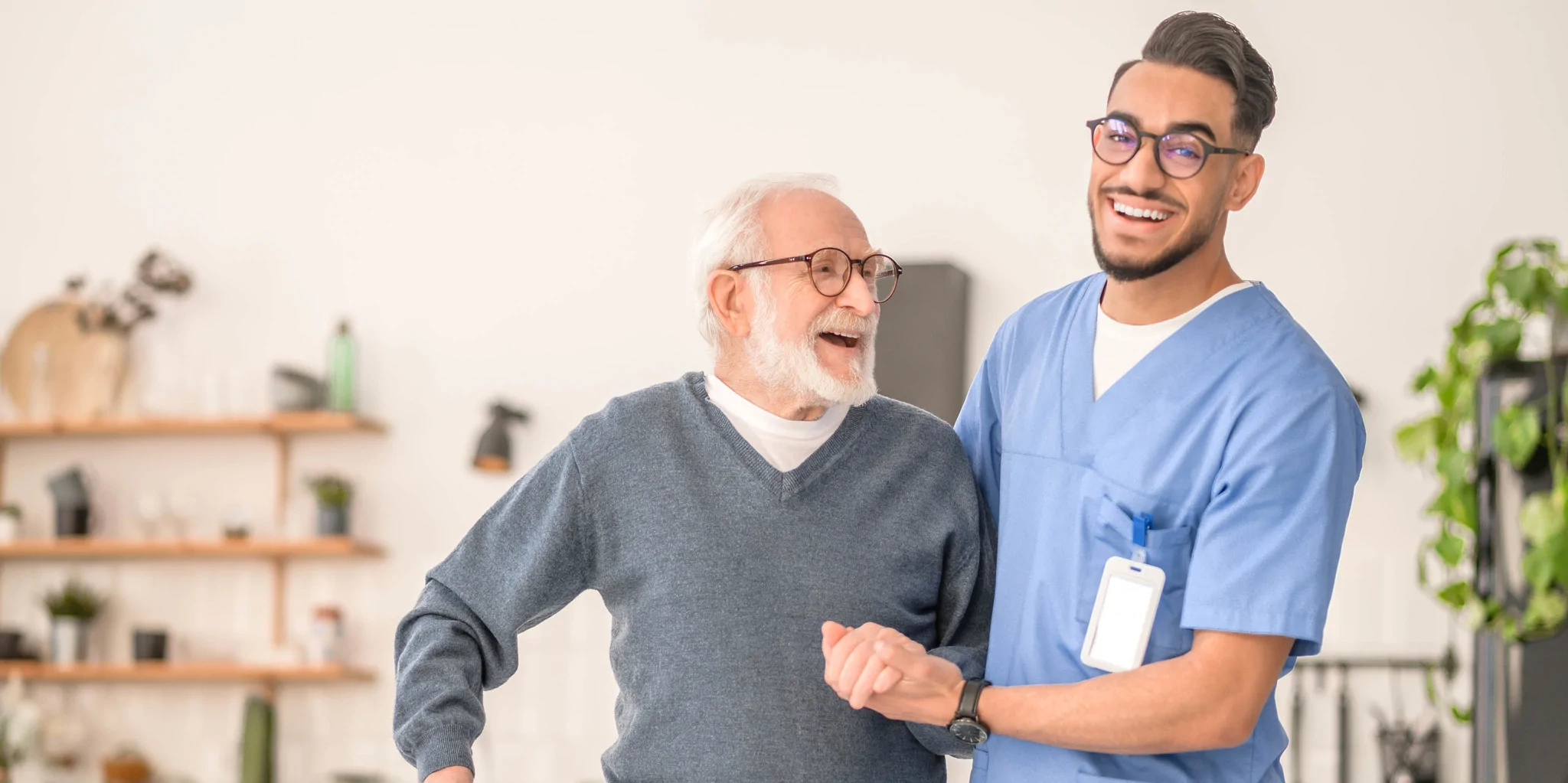 male-healthcare-assistant-helping-elderly-patient