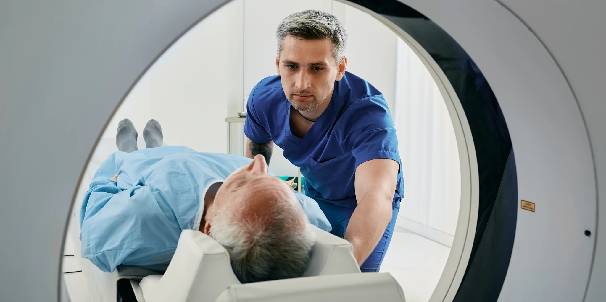healthcare-professional-conducting-scan-on-patient