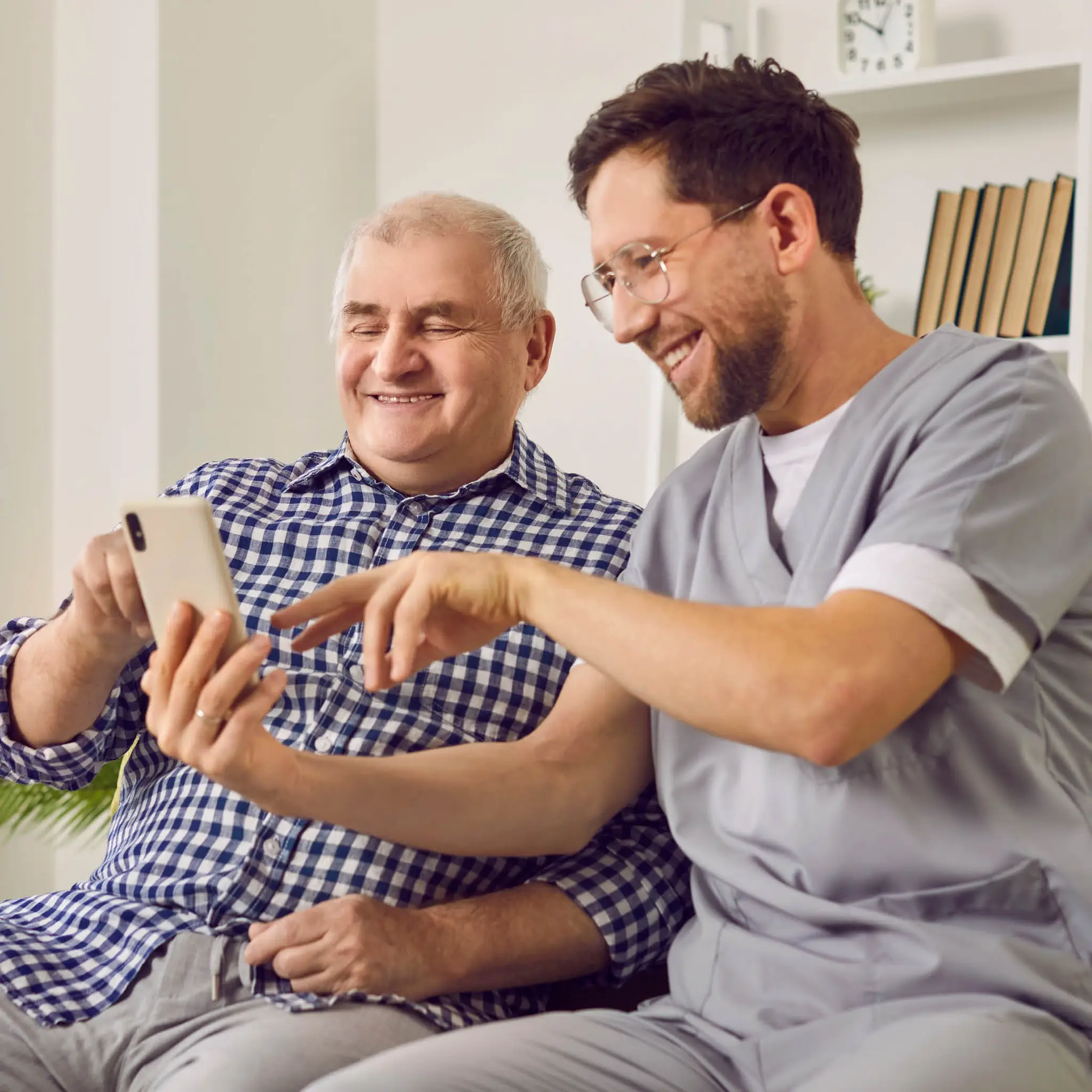 social-carer-assisting-man-at-home