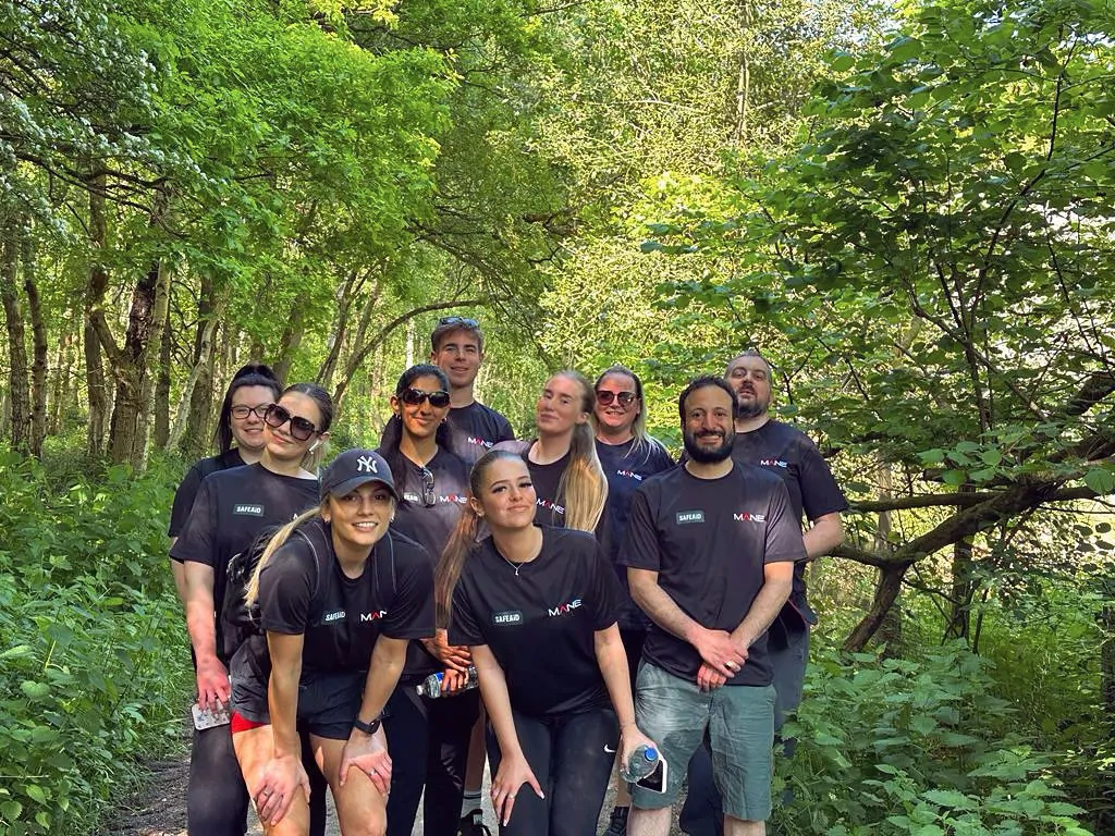 Team, Trees and green space illustrating environmental responsibility.