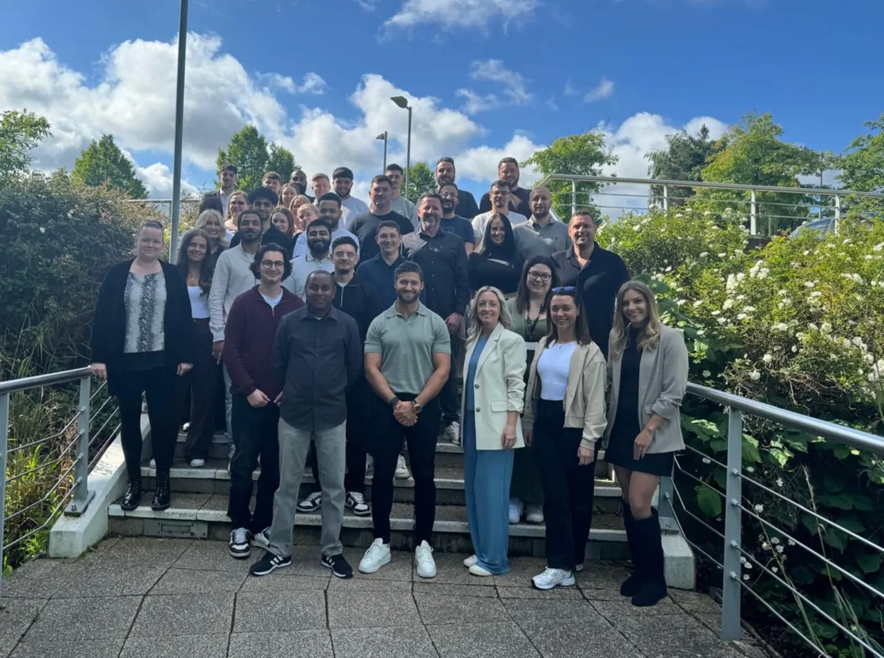 The entire Mane team, on a staircase outside our office 