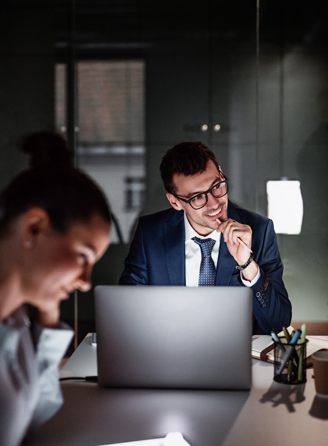a-portrait-of-happy-young-businessman-with-computer-in-an-officeworking-