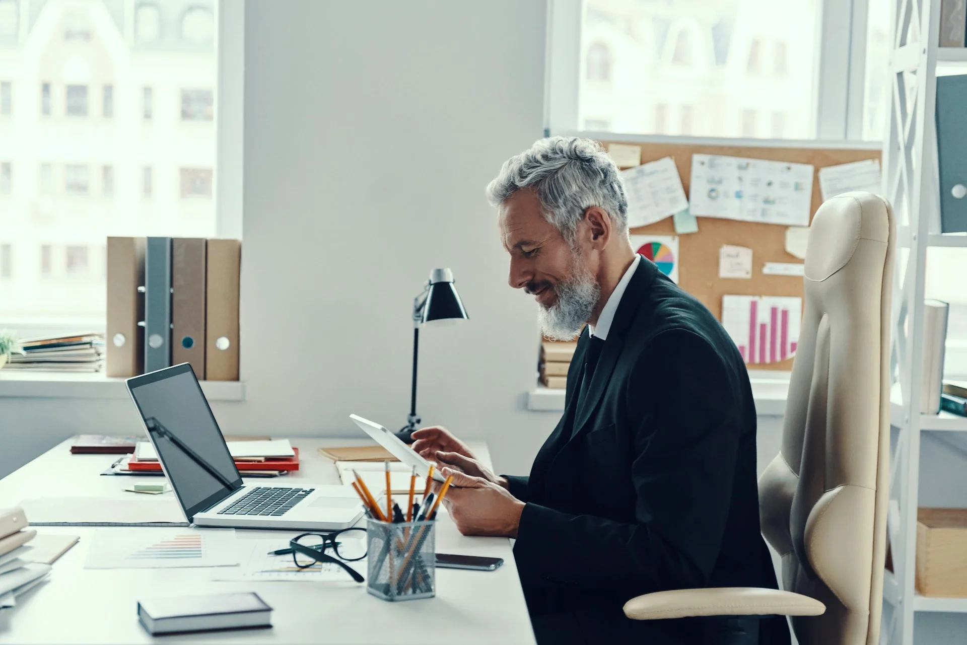 Business man happy looking at screen