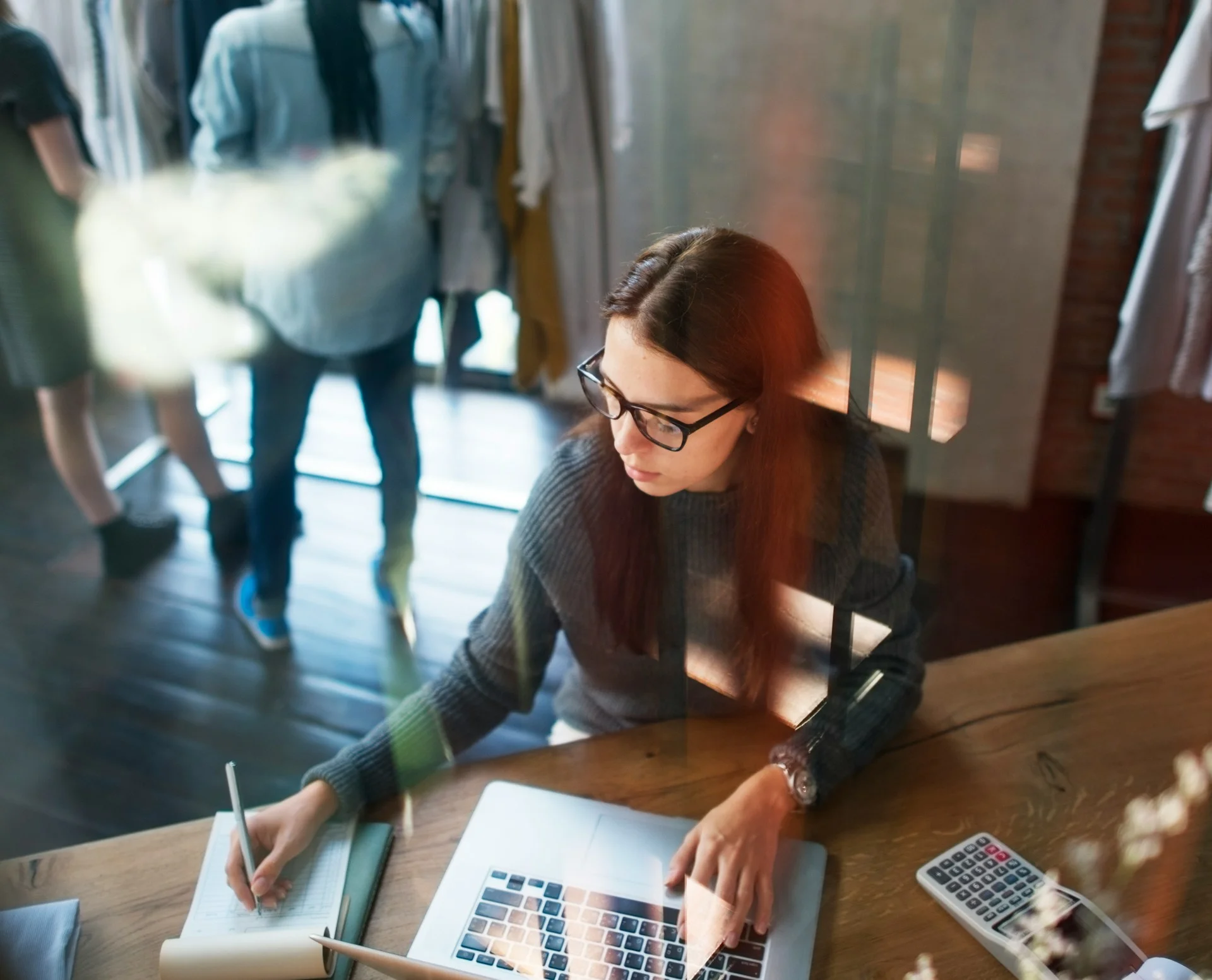 An tech professional on a desktop using a keyboard and mouse