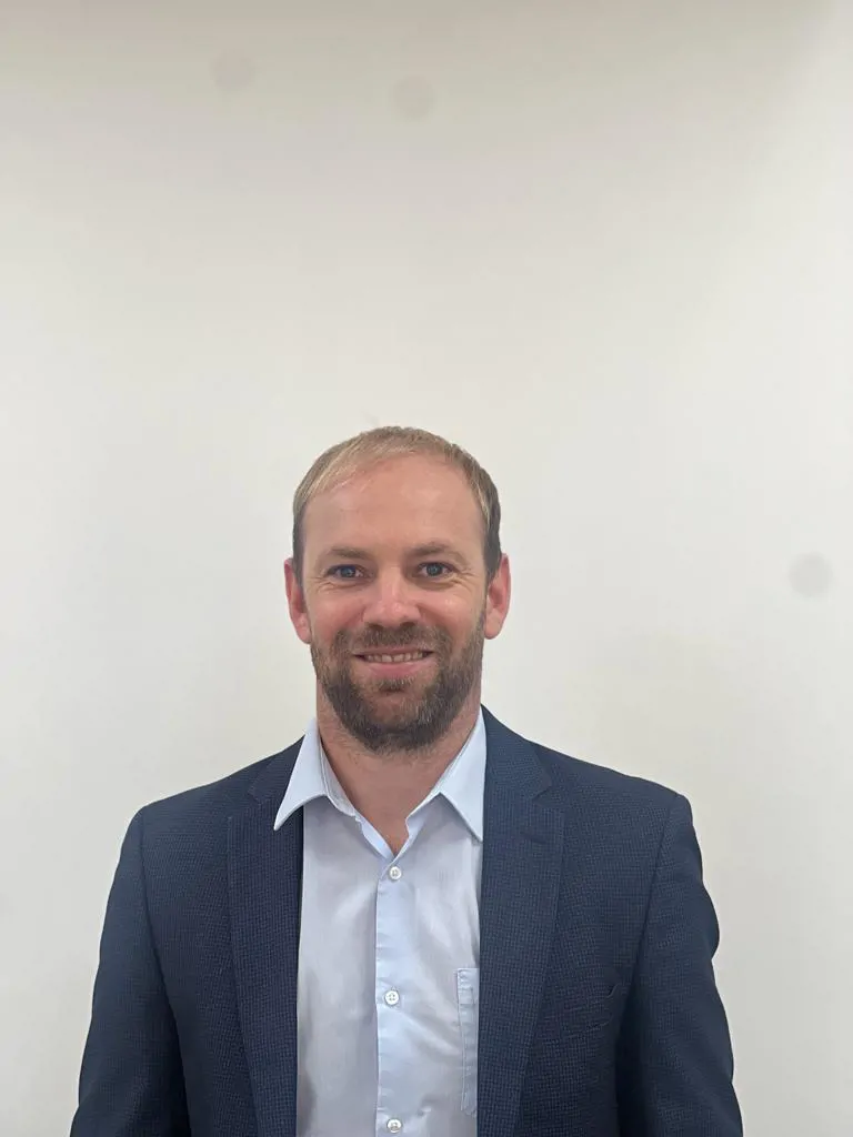 Headshot photo of male consultant branch manager in suit