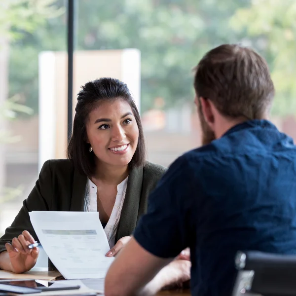 Confident corporate banking advisor guiding client through financial planning