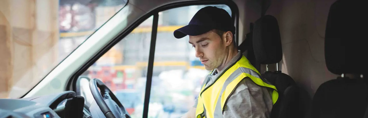 Industrial driver sat in delivery van