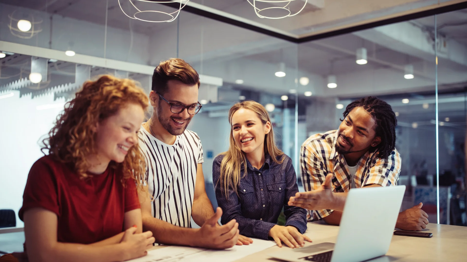 Successful company with happy employees in modern office, creating content for the business