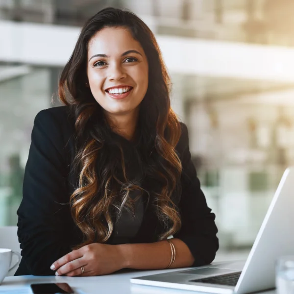 Financial analyst working on investment data and charts at a computer