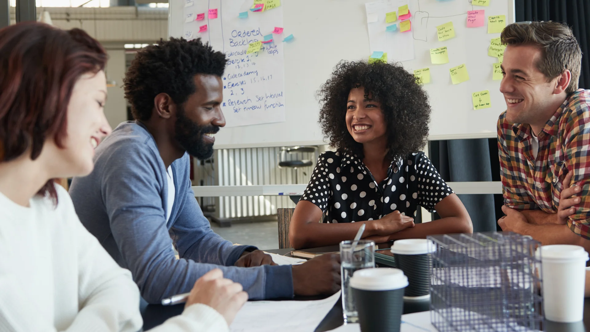 Diverse group of professionals having a meeting around a conference table