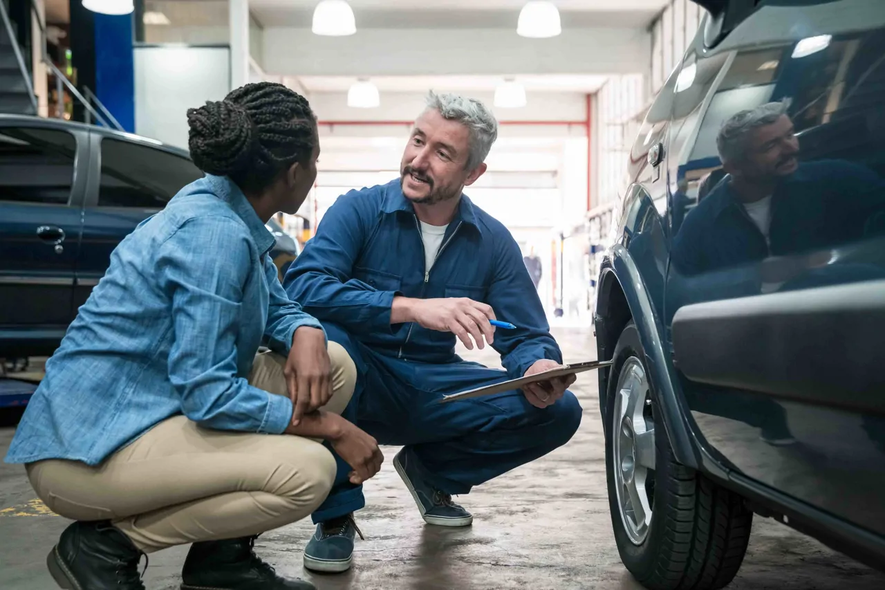 An engineer demonstrating a task to a colleague