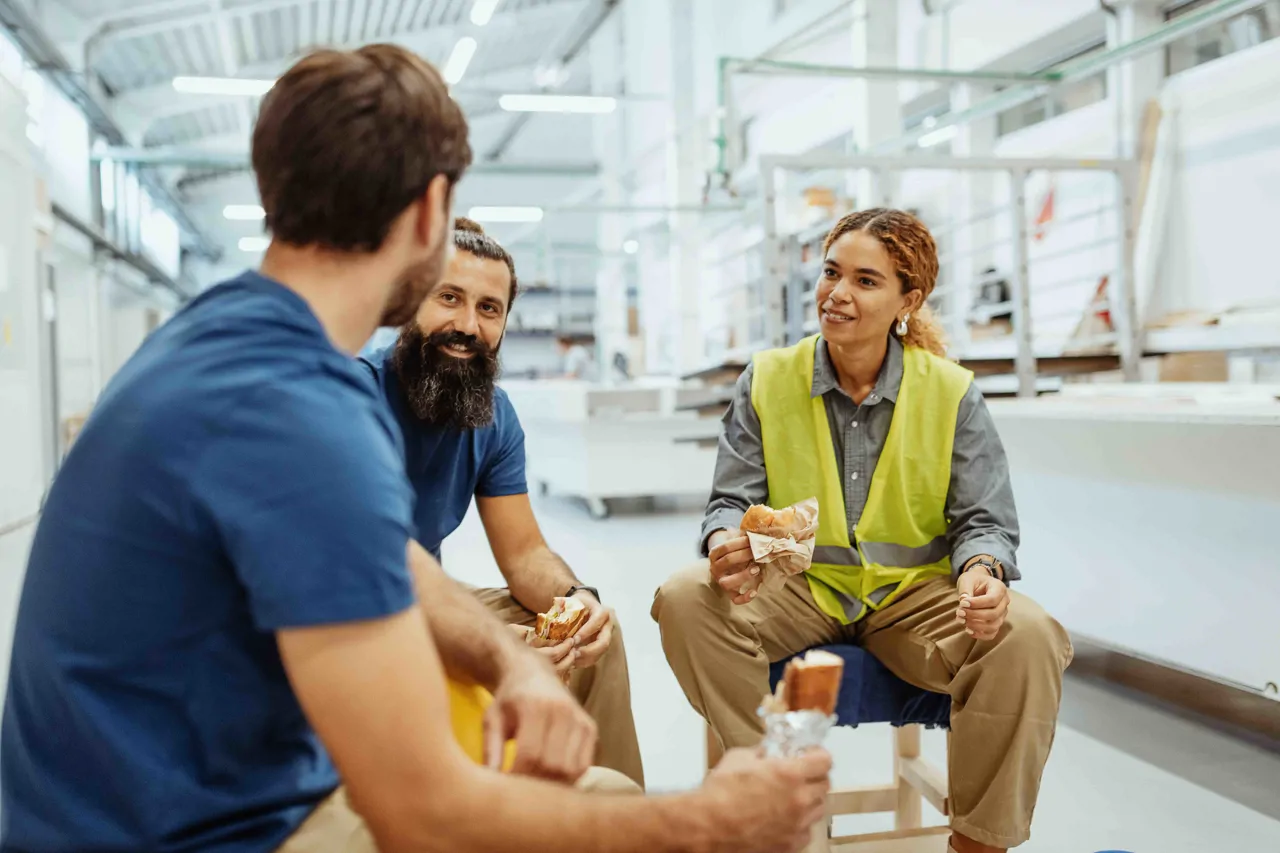 Three industrial workers on a break