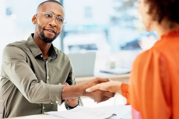 Colleges in an office meeting greeting each other