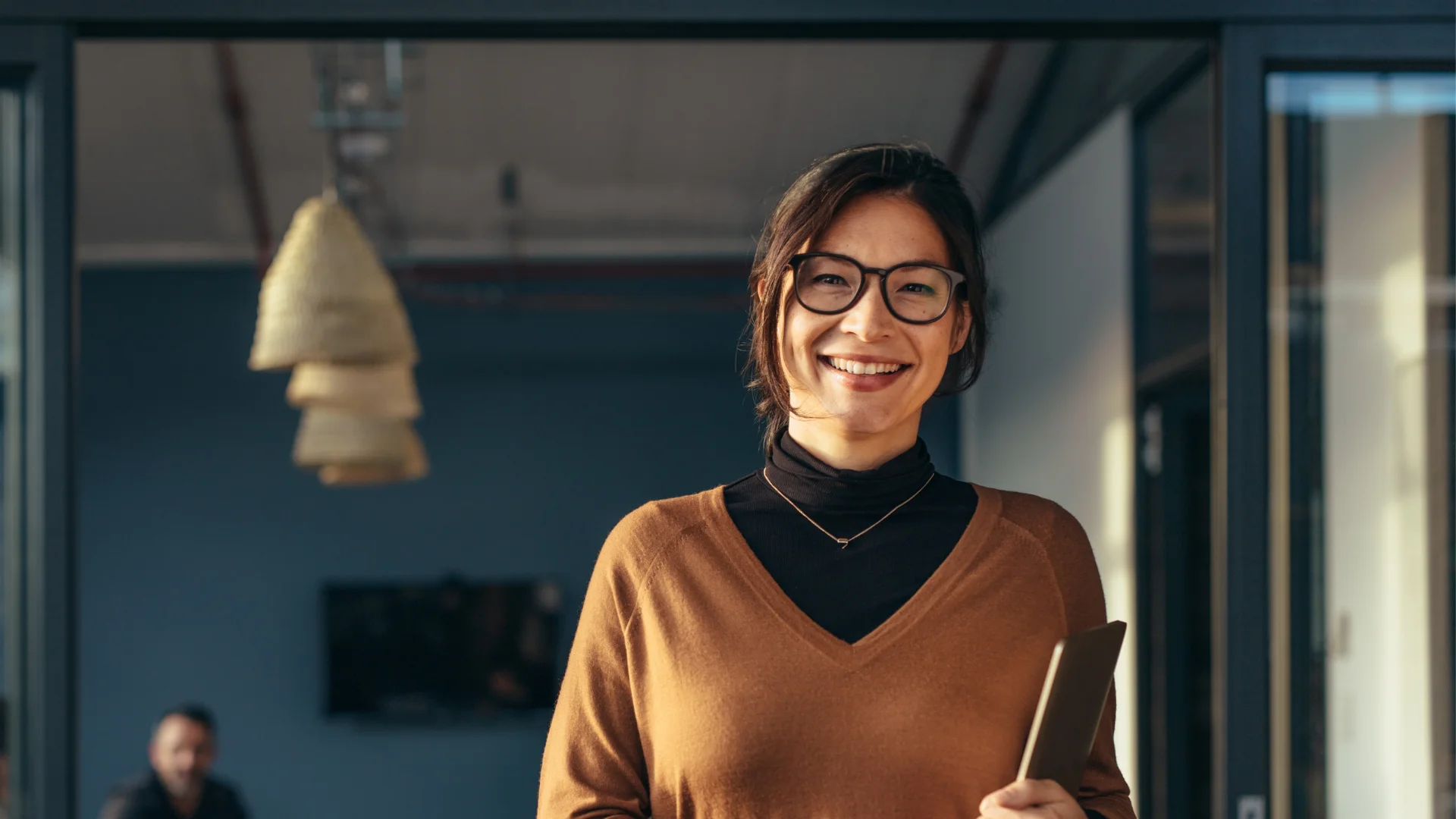 Smiling Business Woman in a sweater at Office