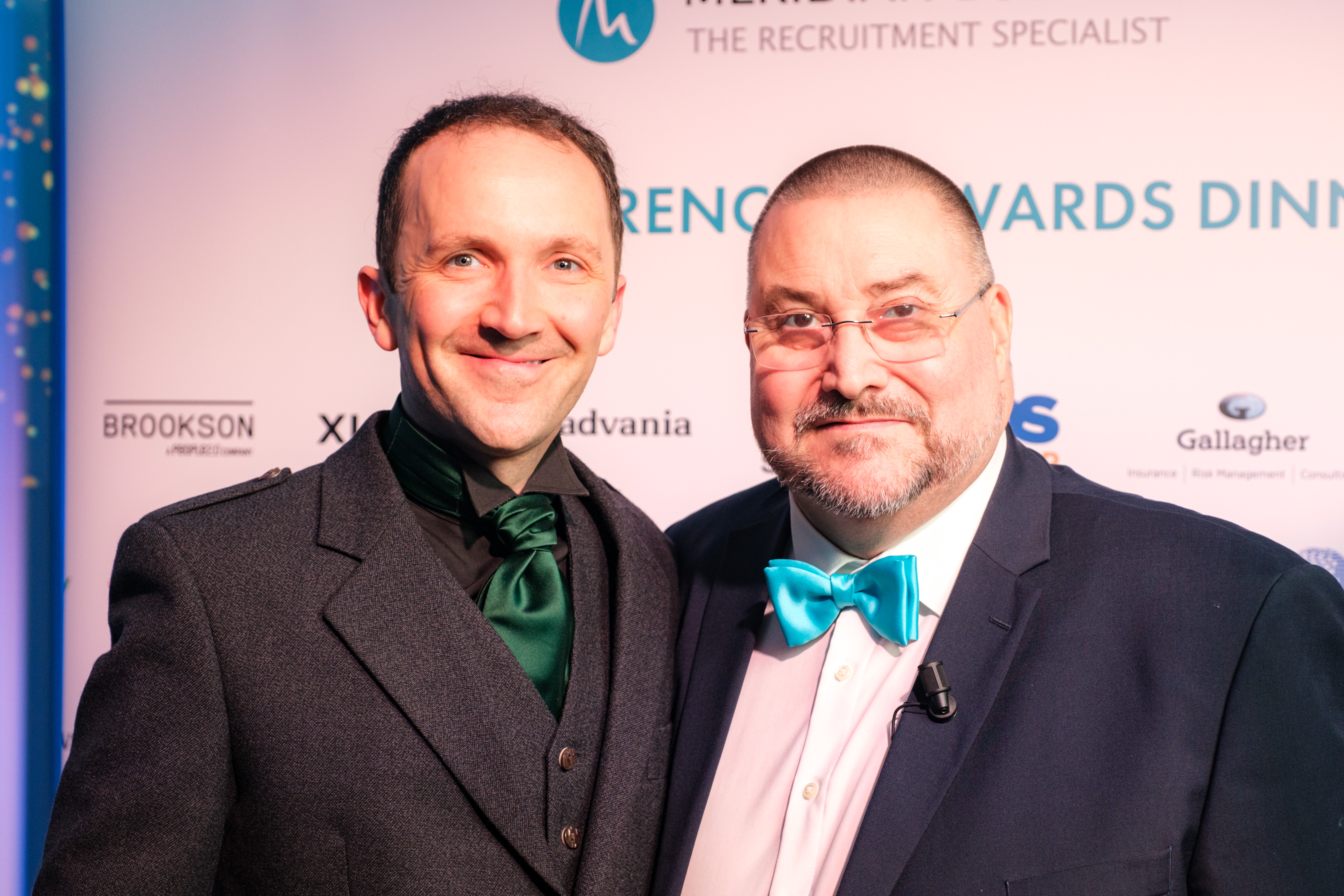 Meridian Annual Conference & Awards: Photo of winner of Whatever It Takes Award on stage next to Meridian's CEO