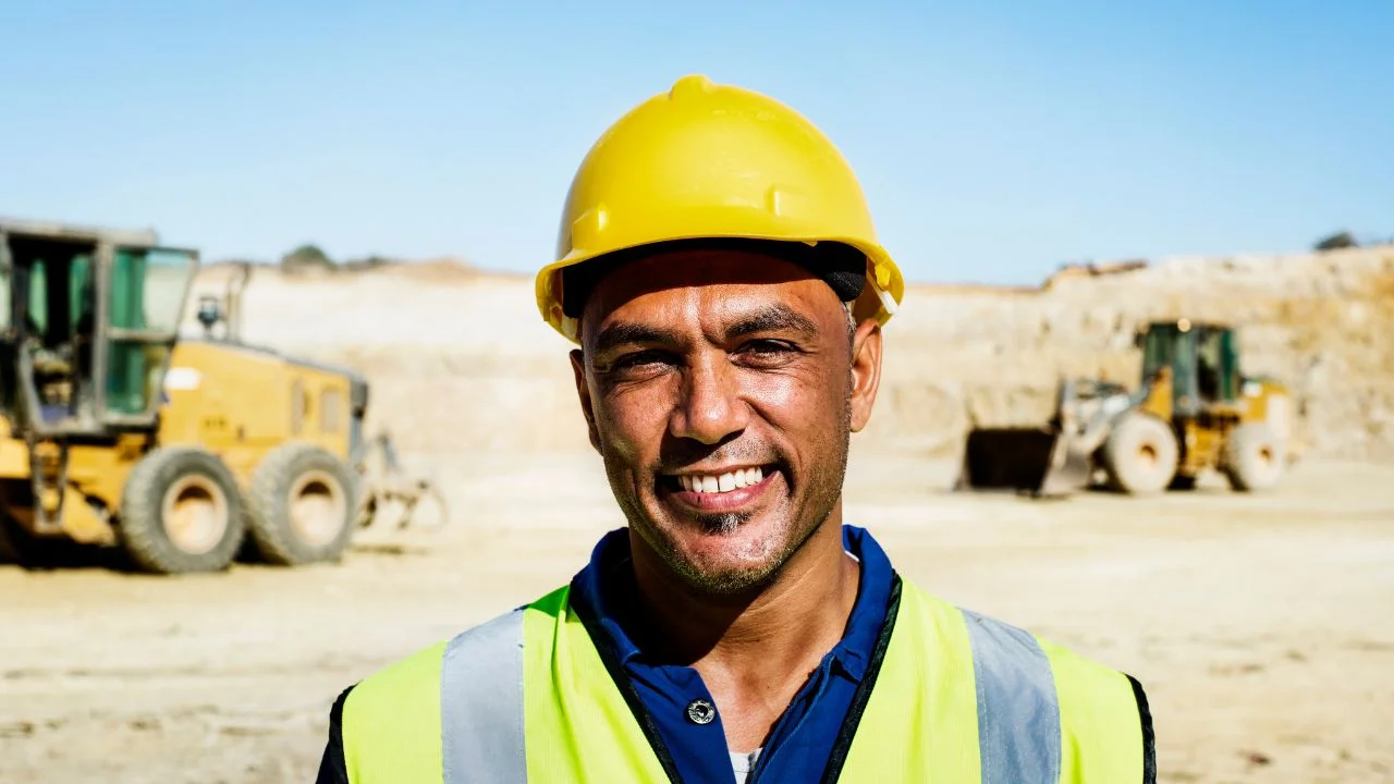 man on mining site with a helmet and hi vis jacket