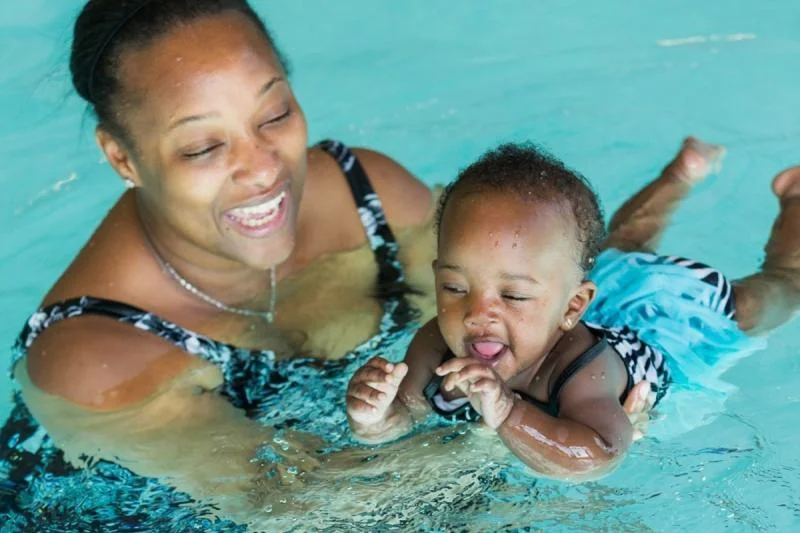 Mother and child swimming