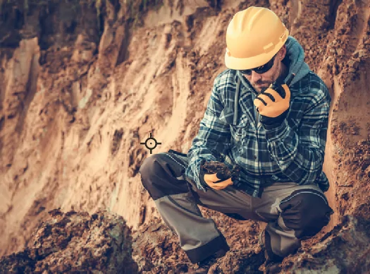 man examining soil