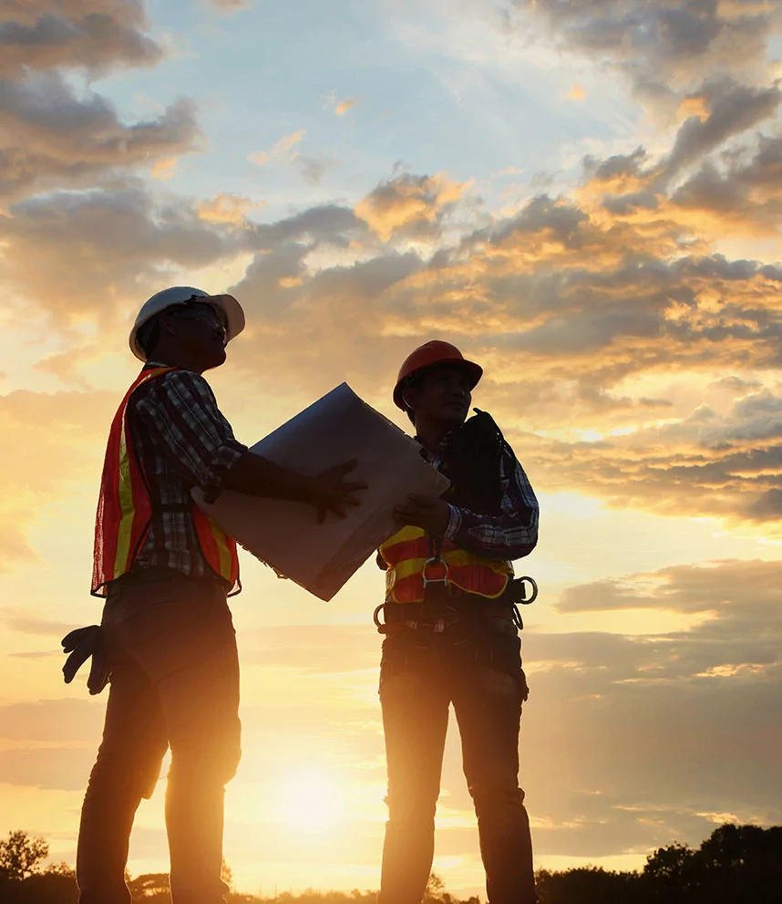 surveyors at sunset