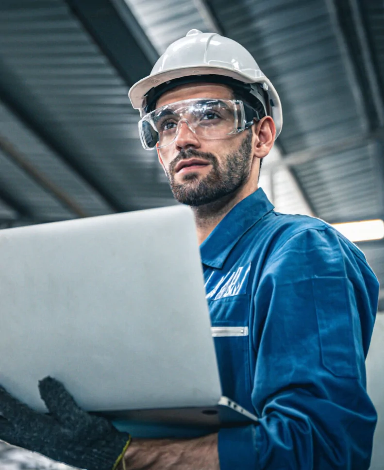 man in plant with laptop