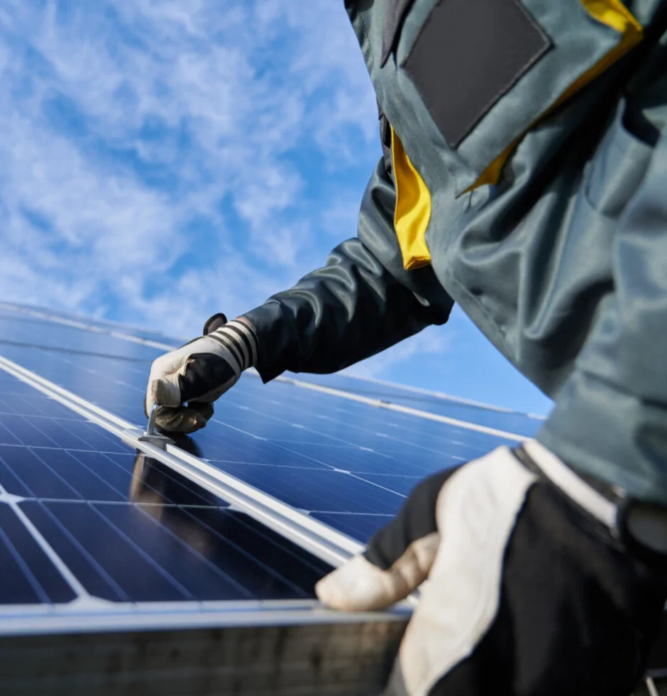 man fixing solar panels