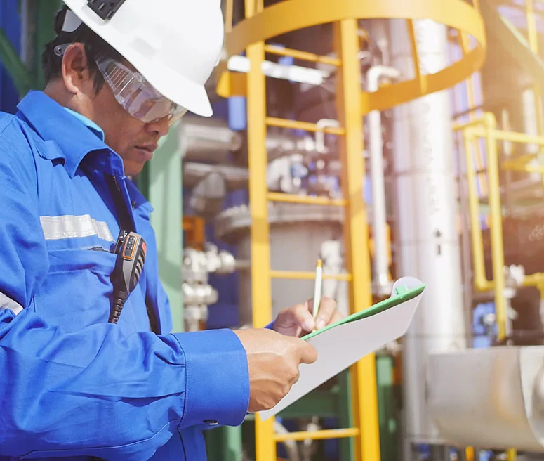 engineer taking notes on facility