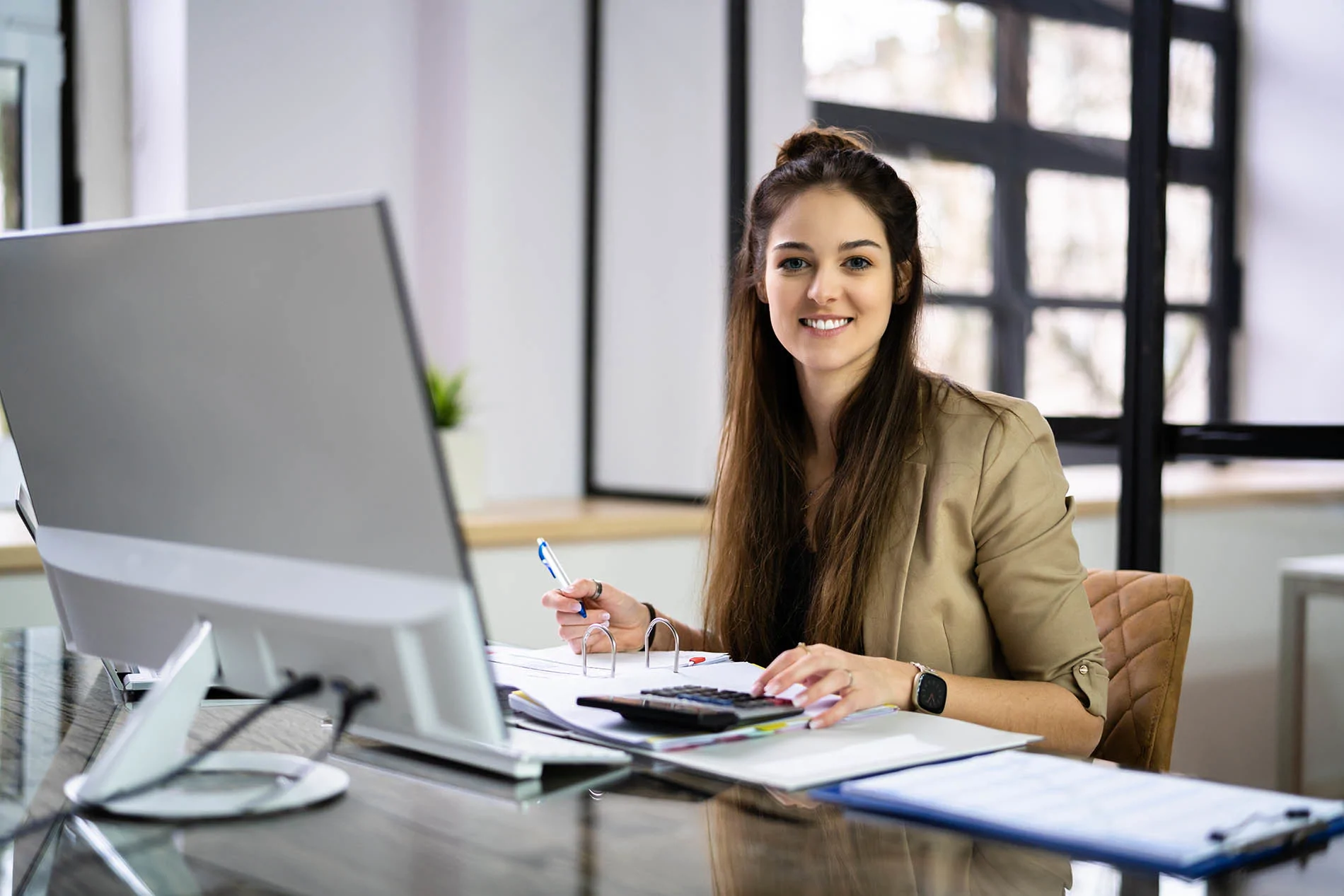 secretary in office on laptop