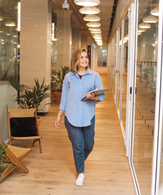 female walk down corridor 