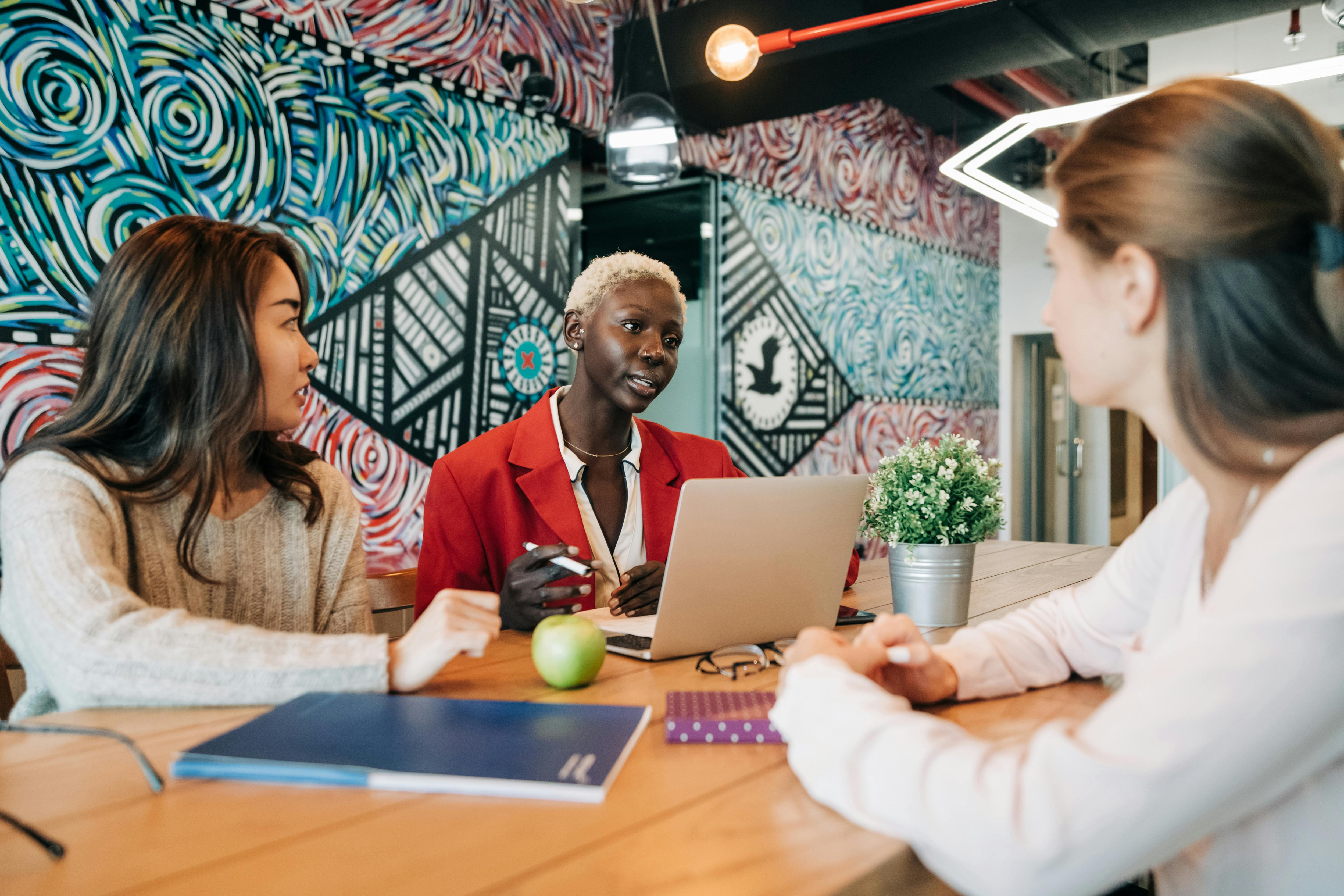 diverse group of females discuss training