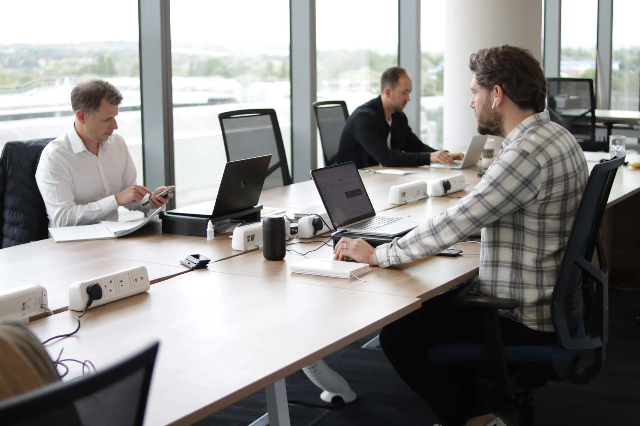 Members of the Pharma team working at desks