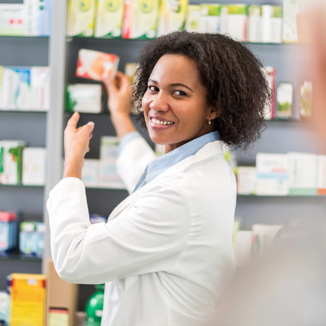 Pharmacy technician working in a community pharmacy