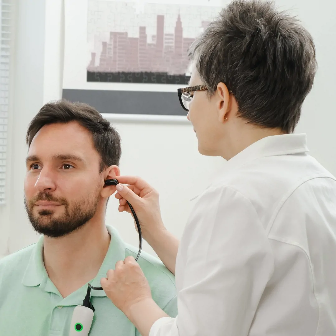 audiologist checking hearing