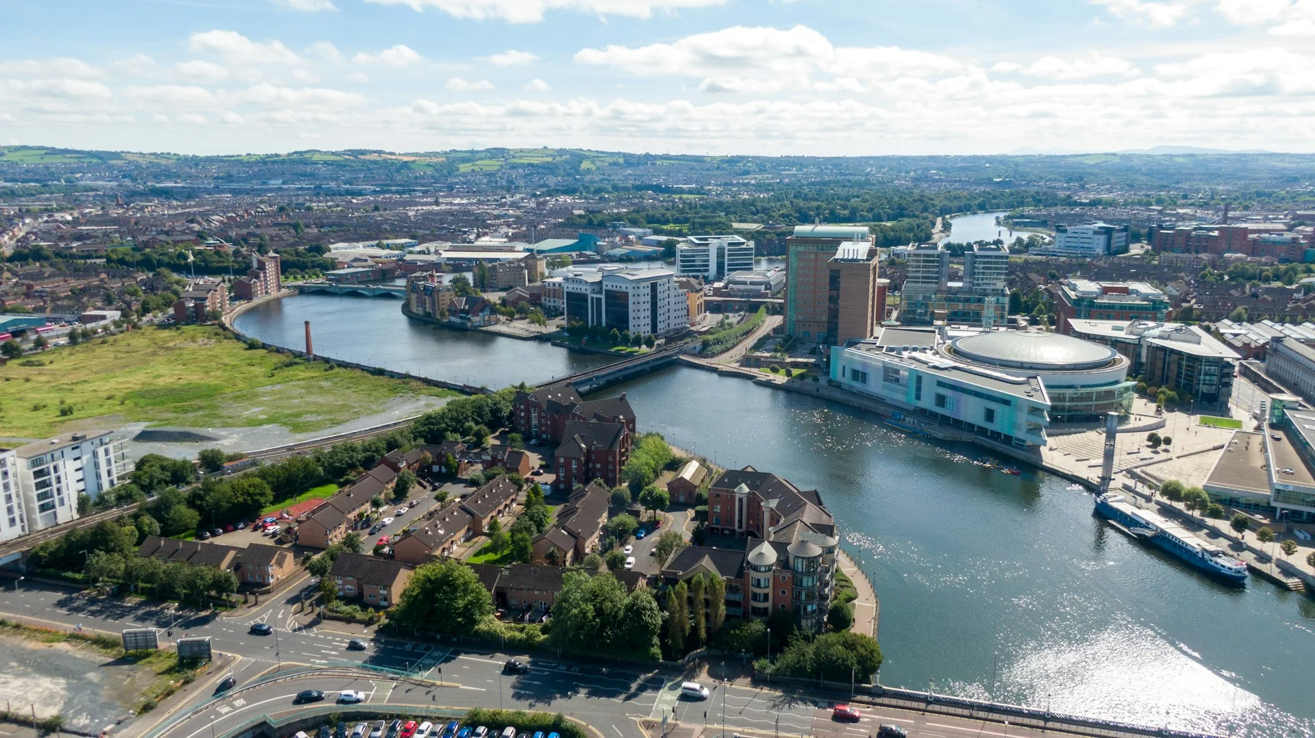 aerial-view-on-buildings-and-lagan-river-in-city-center-of-belfast-northern-ireland-drone-photo-high-angle-view-of-town-