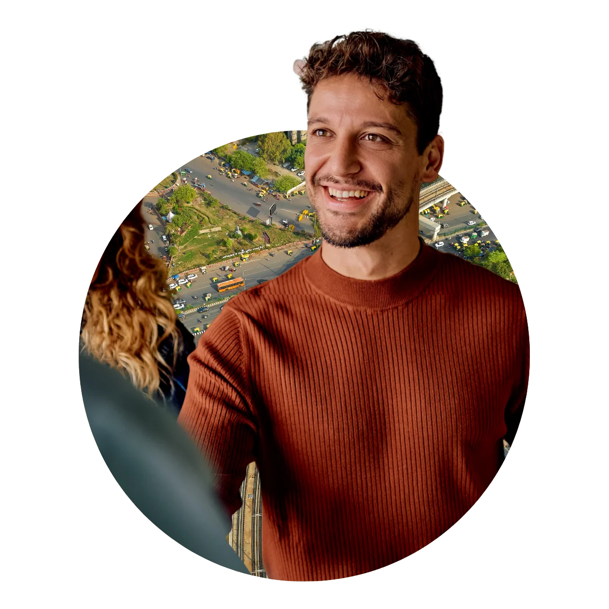 Man in orange top smiling