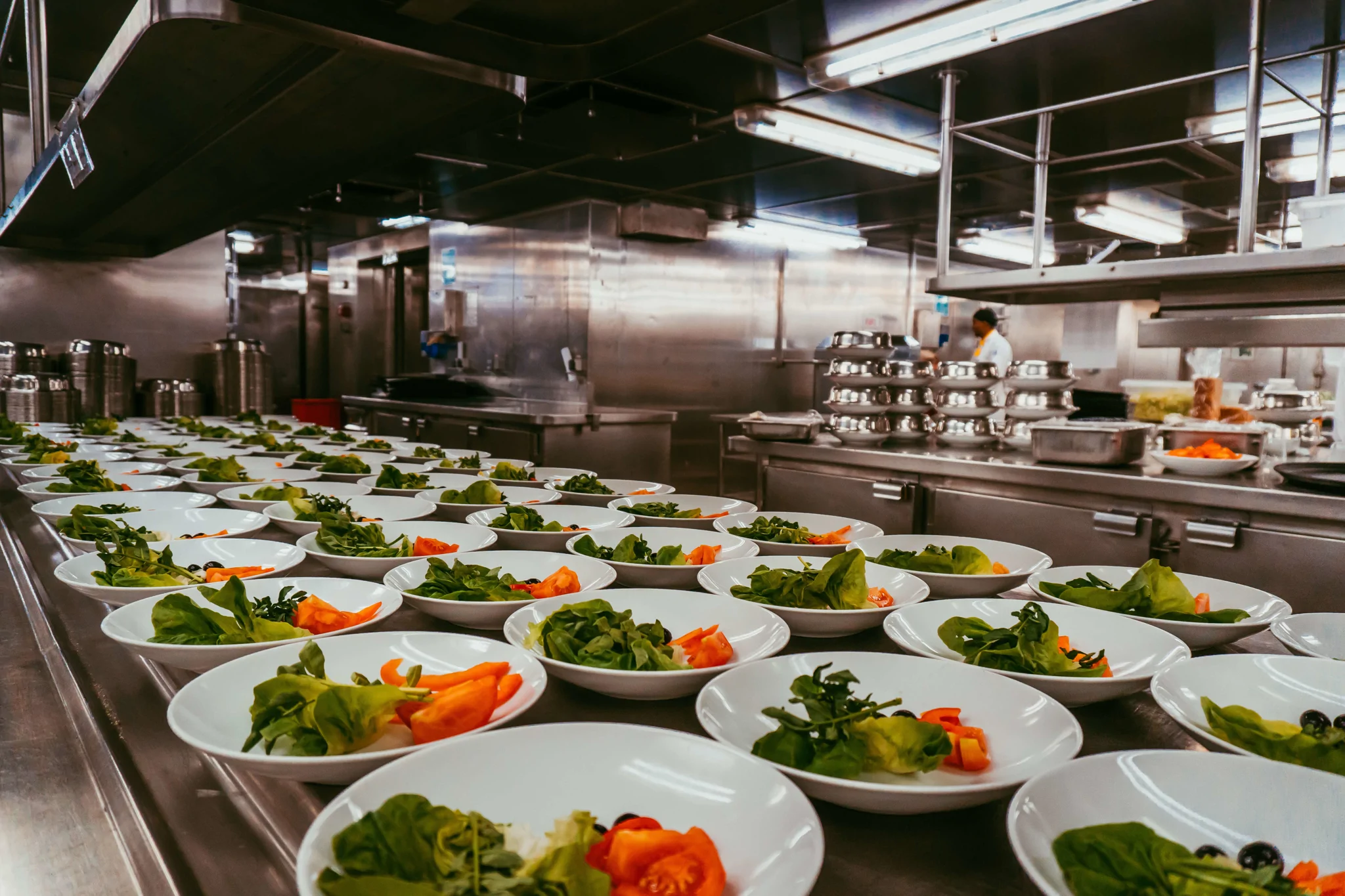 multiple dishes laid out in galley on vessel