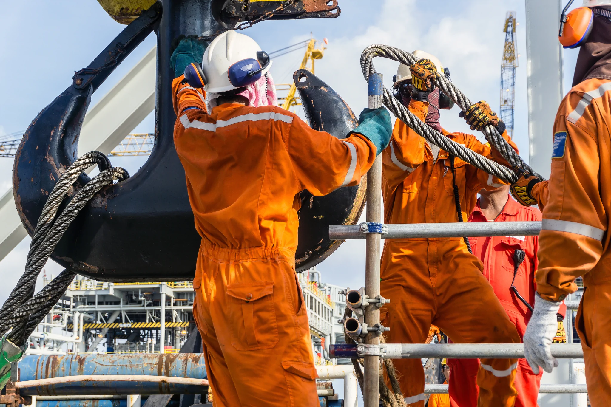 crew working together with heavy lift