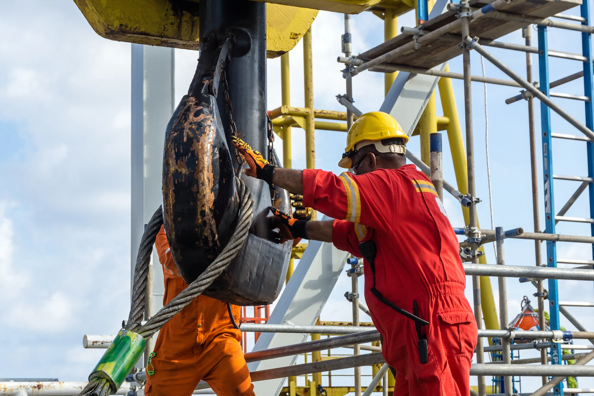 workers with heavy lift