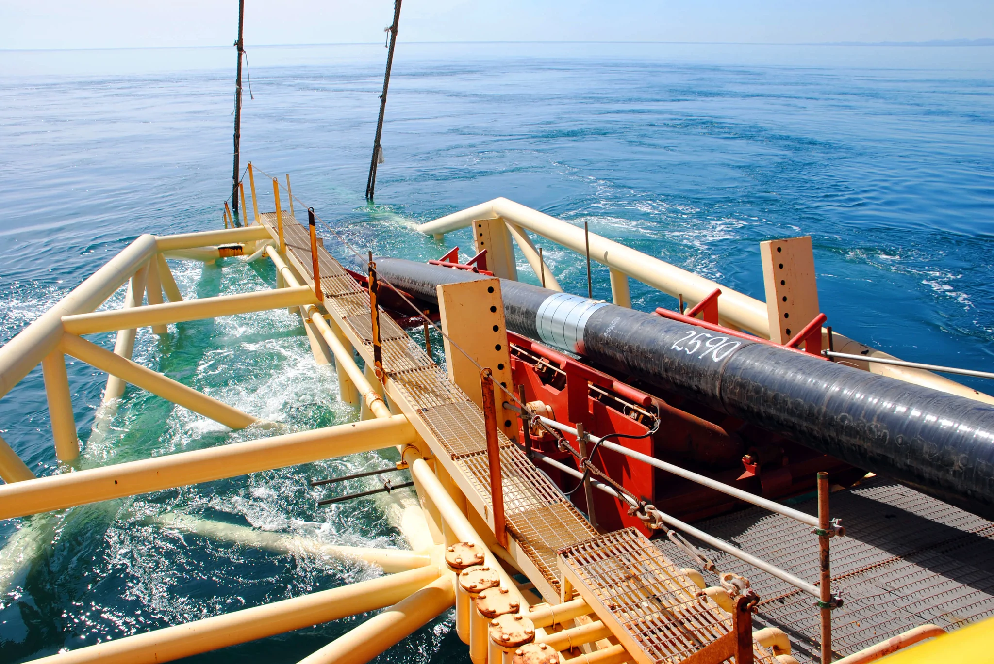 pipe laying equipment on end of boat