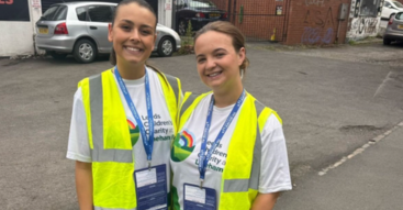 Amie Foley and Neave Oseghae volunteering at Leeds 10K