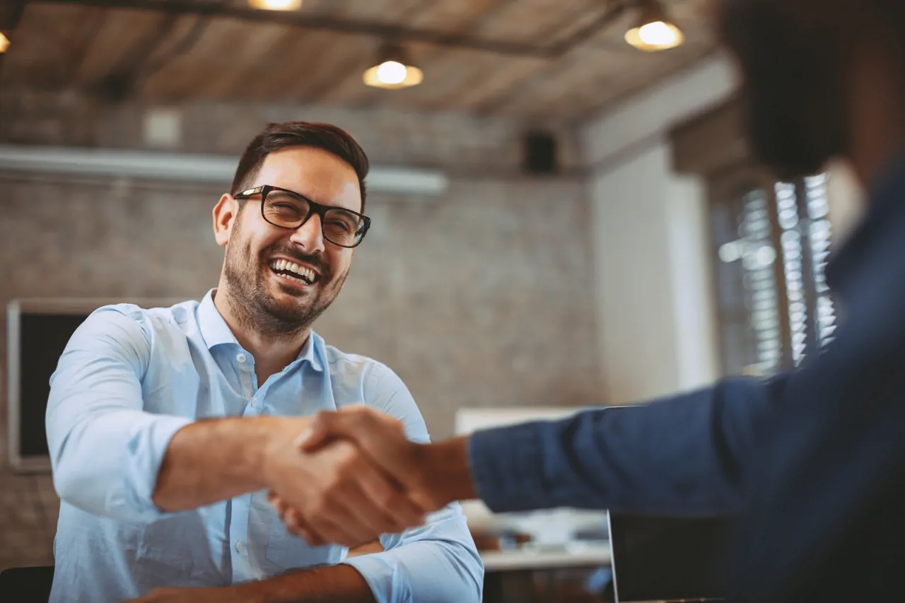 Man shaking hands with interviewer