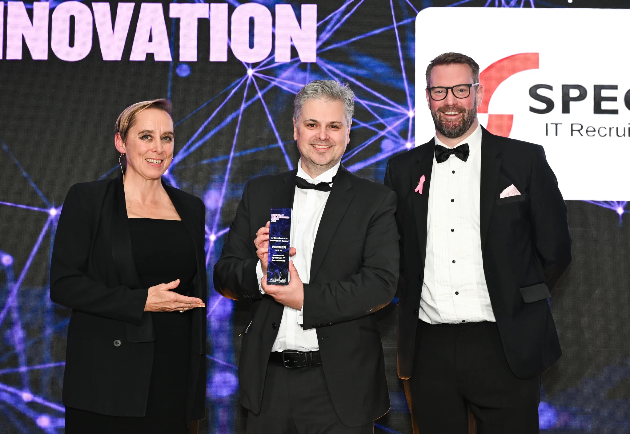 ICS.AI representatives receiving the 2025 AI Innovation of the Year Award at the South Coast Tech & Innovation Awards.