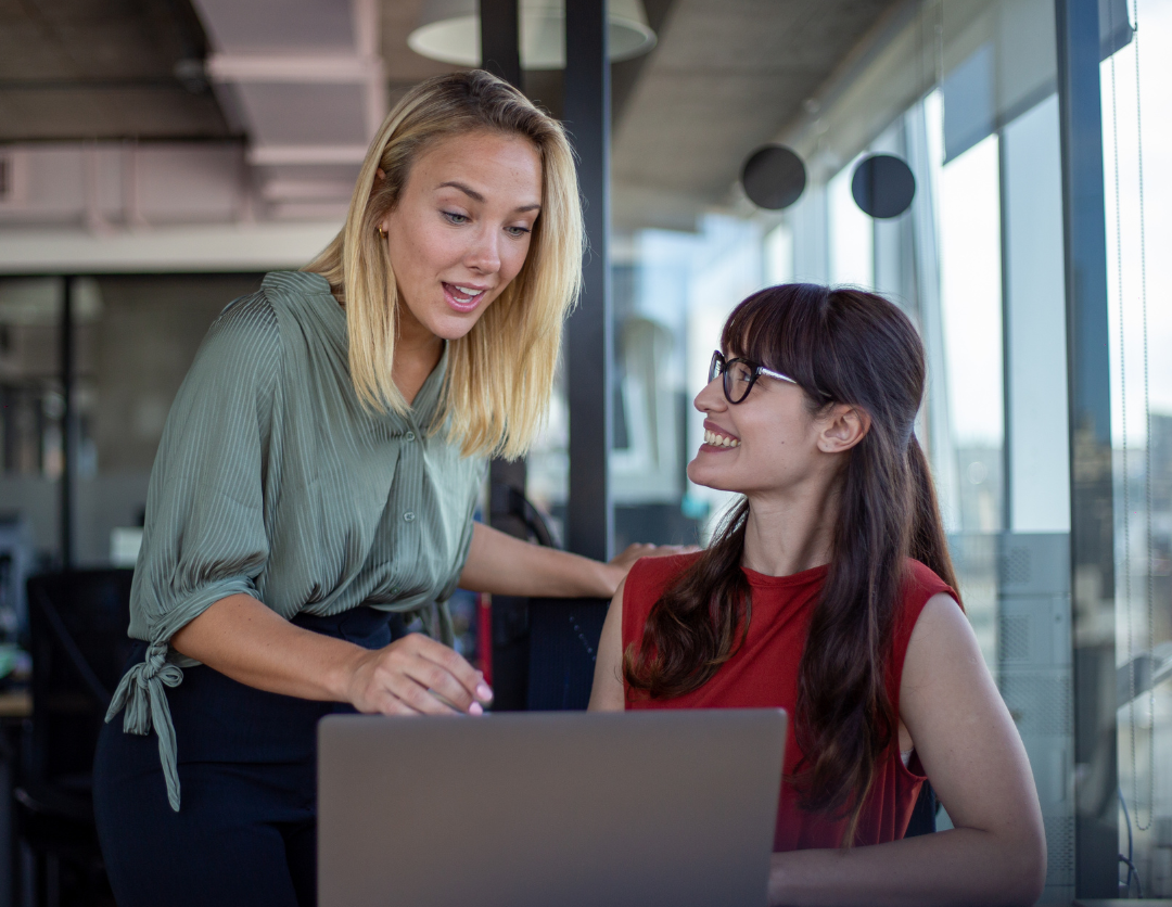 Two finance professionals looking at each other