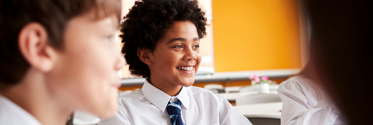 Two school boys sat in class