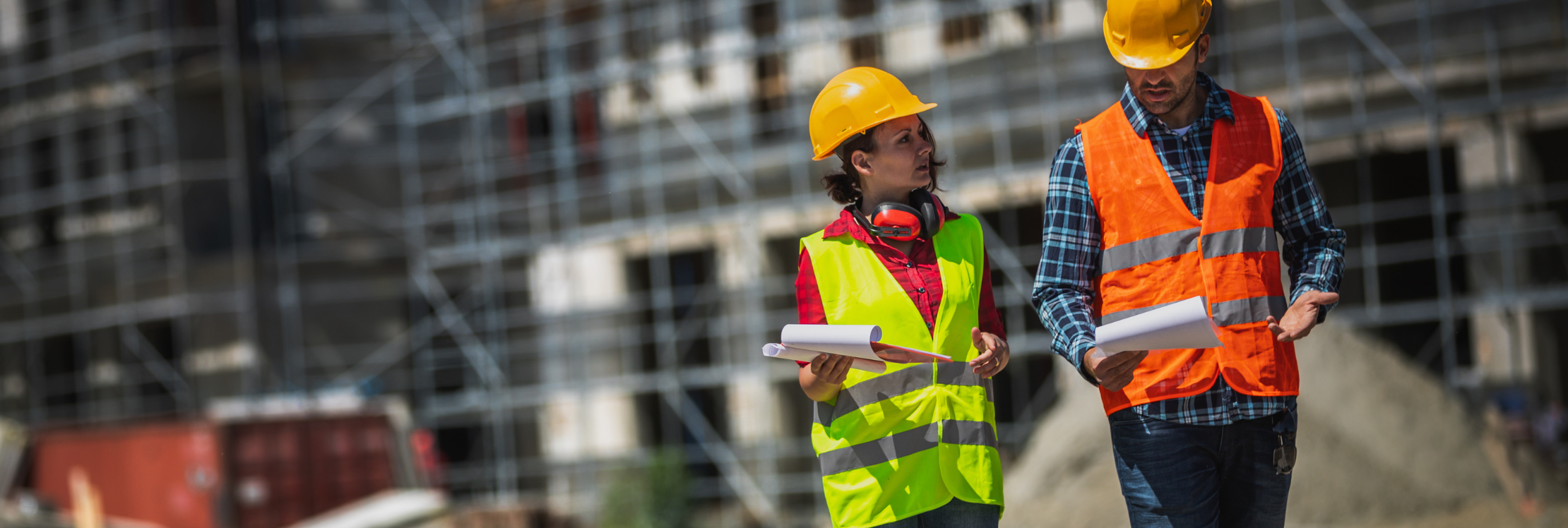 Site workers walking across a building site