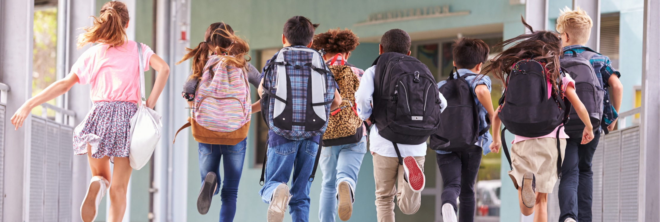 School children running into a school