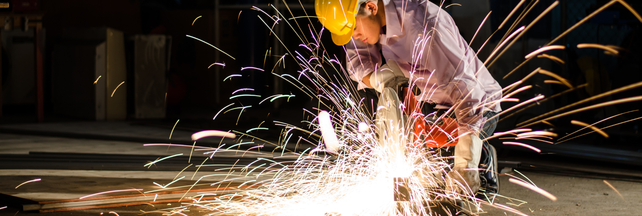 A construction worker completing welding work