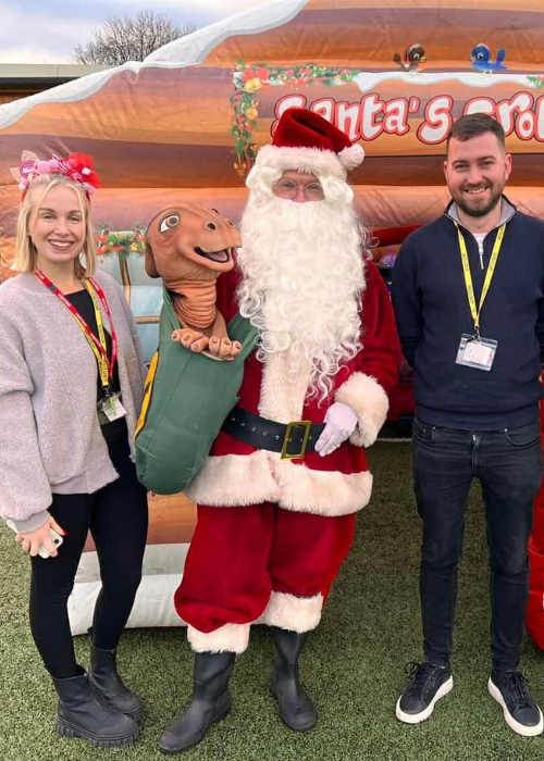SCG employees with a santa at a school