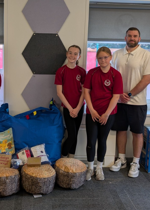SCG employee at a school with sensory equipment and school children